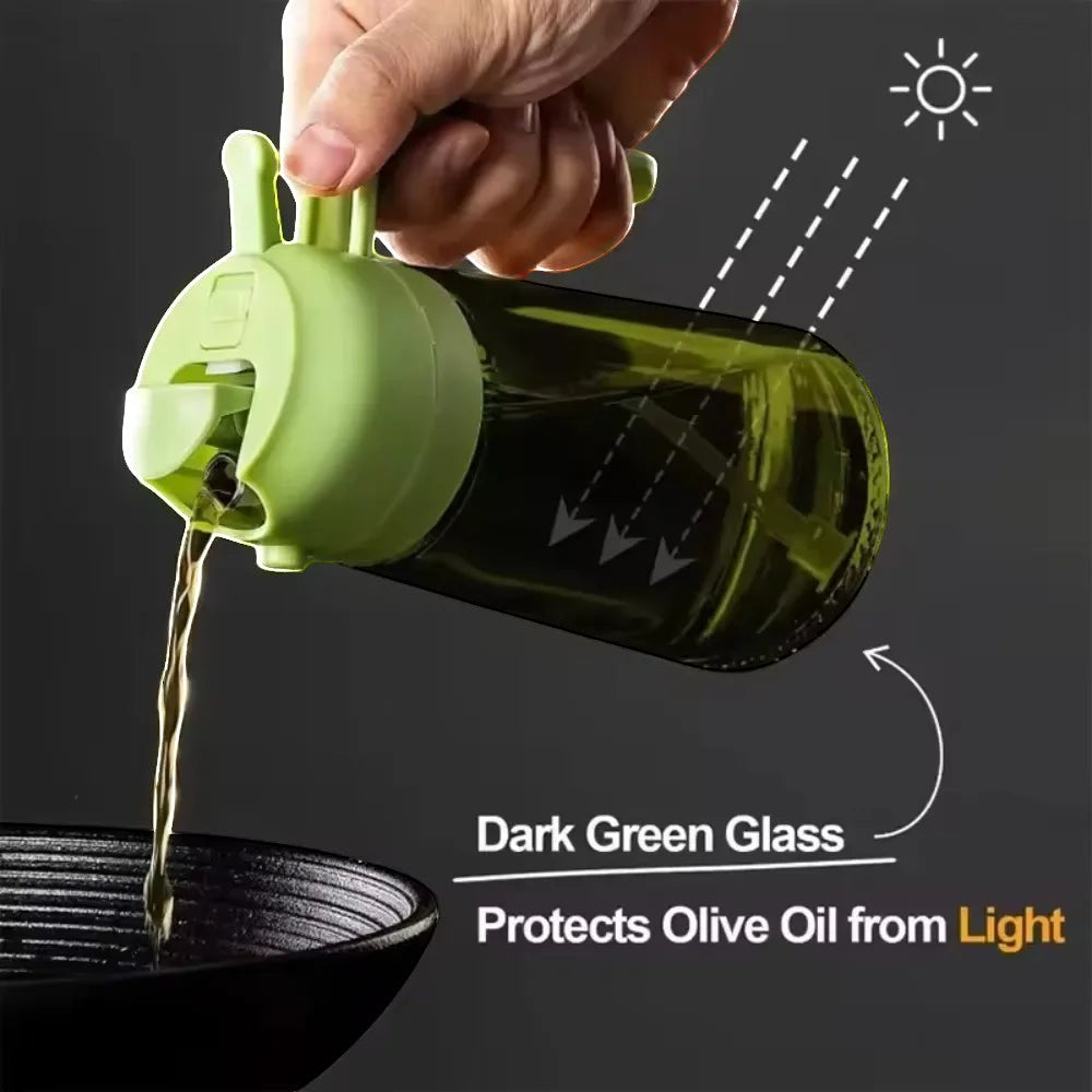 The OmniPour™ dark green glass oil dispenser bottle with a green handle, perfect for misting oil on food.